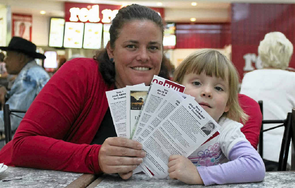 Sandra Ellis and four-year-old daughter Jessica assess their councillor and mayoral candidate options. Sandra Ellis and four-year-old daughter Jessica assess their councillor and mayoral candidate options.
